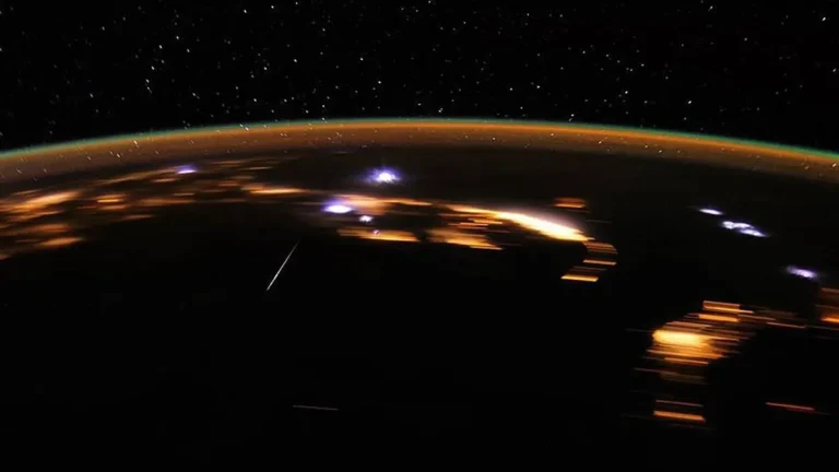 Earth at night with meteors burning up in the atmosphere. Image credit: NASA/JSC/D. Pettit