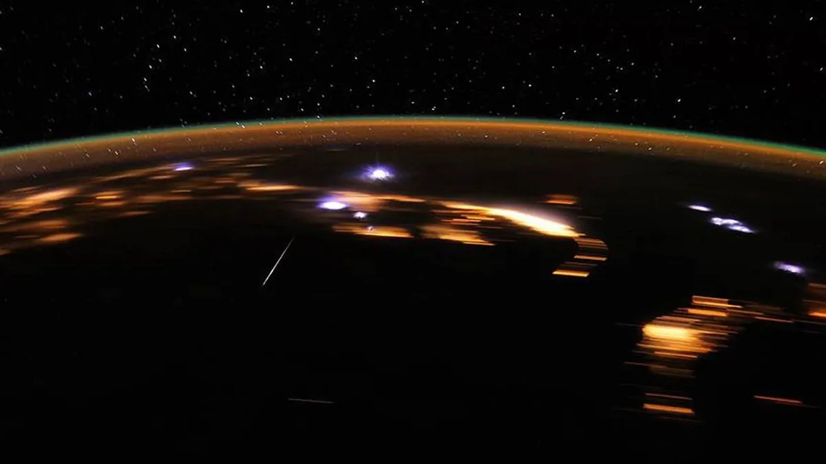 Earth at night with meteors burning up in the atmosphere. Image credit: NASA/JSC/D. Pettit