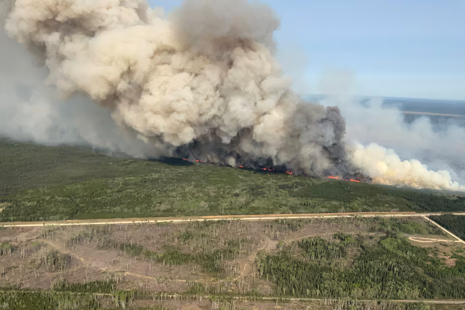 Smoke rises from wildfire WE023 near Wanless, Manitoba, Canada May 27, 2025.